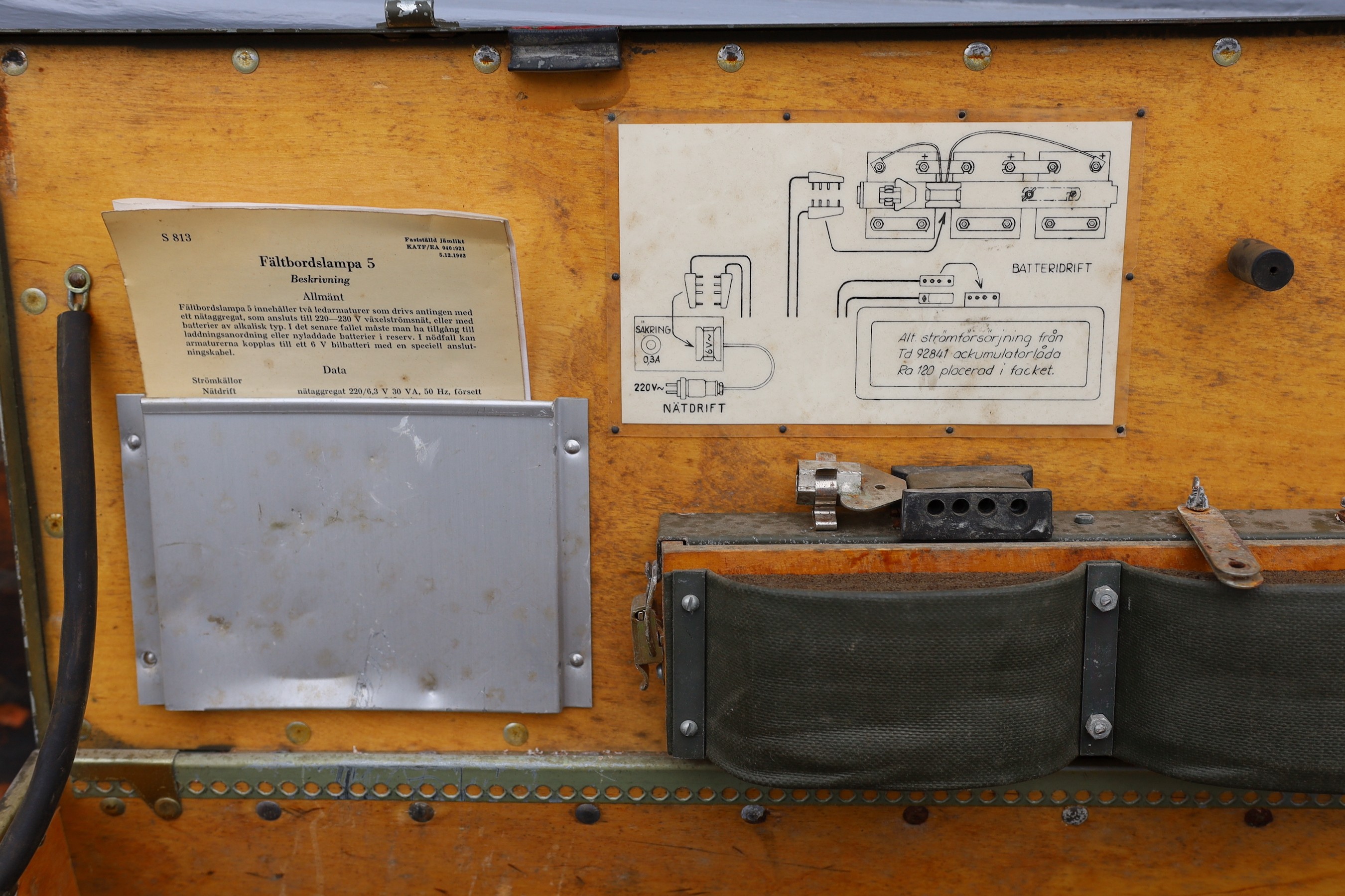 A pair of Swedish Army Carlson Varberg anglepoise lamps with accessories and original instructions dated 1963, in original trunk marked ‘Faltbordslampa 5’, height of lamp to bend 65cm. width of case 83cm